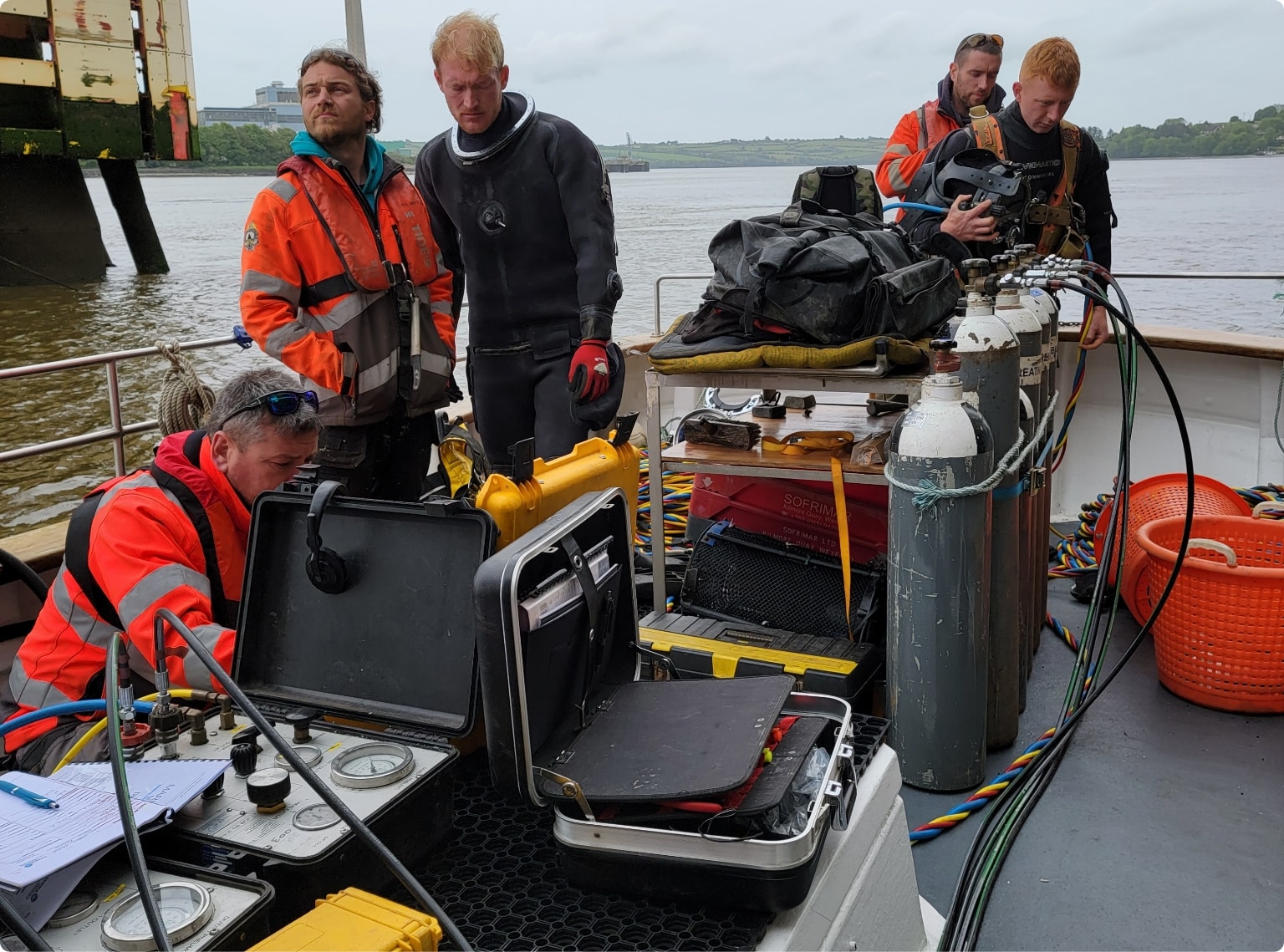 Boat crew diving and researching